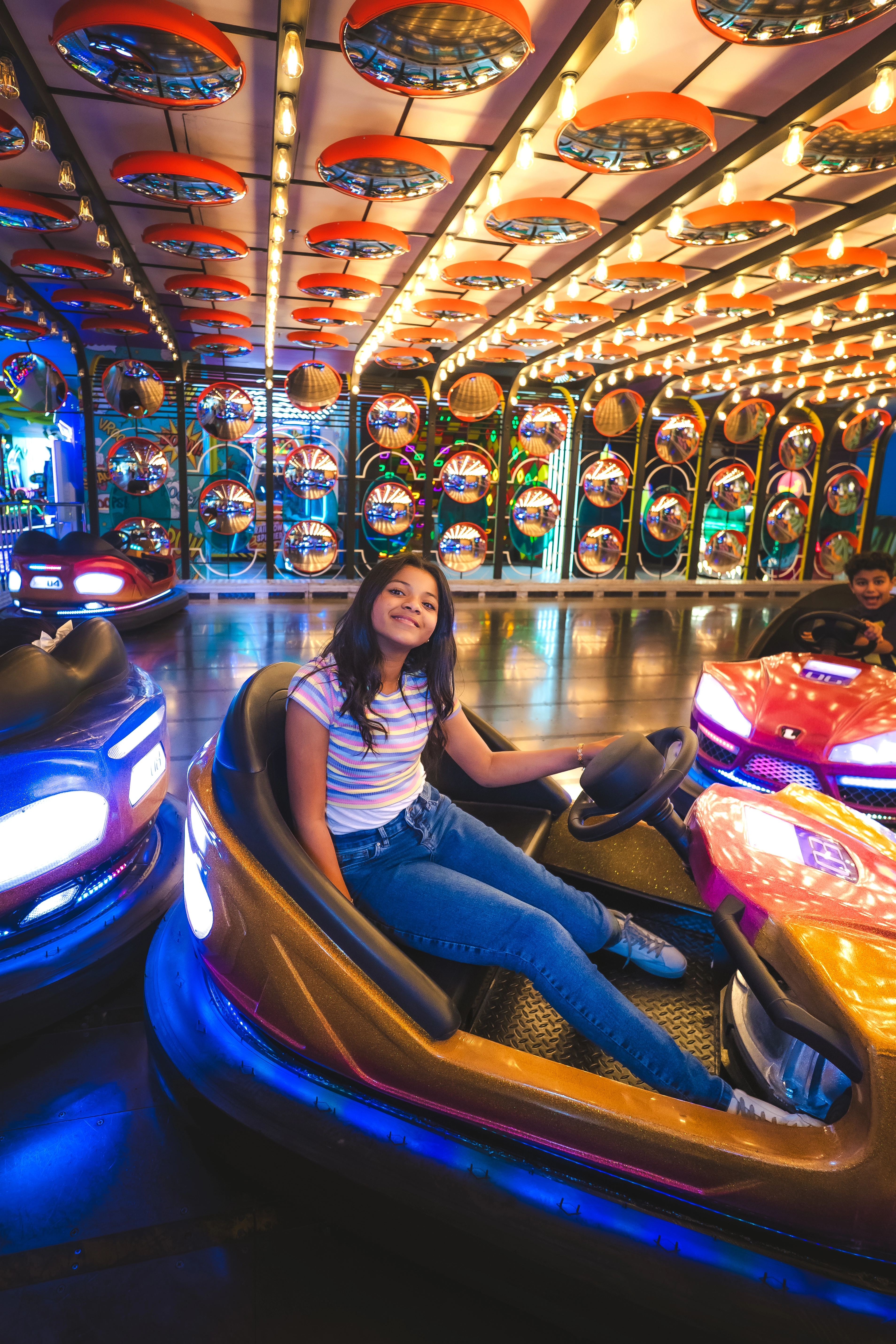 Family enjoying bumper cars at a Dabdoob World venue